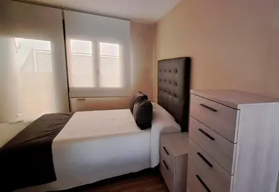 Cama o camas de una habitación en Apartamento La Monina CUEVAS DEL VALLE