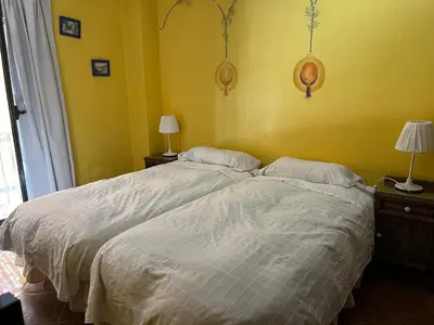 Cama o camas de una habitación en LAS CUATRO CALLES Bis