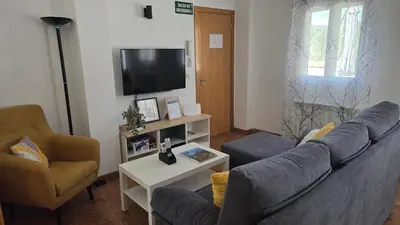 Una televisión o centro de entretenimiento en Ático Vista La Sierra