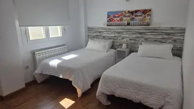 Cama o camas de una habitación en Ático Vista La Sierra