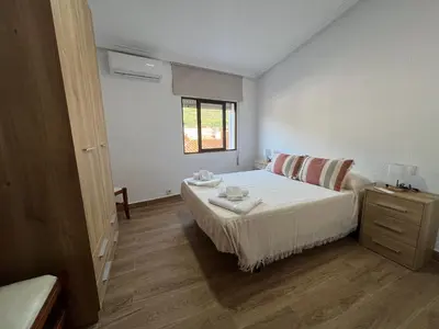 Cama o camas de una habitación en El Mirador de Cabezuela, apartamento con vistas al Valle del Jerte