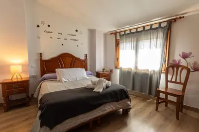 Cama o camas de una habitación en Hostal La Balsá