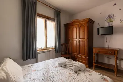 Cama o camas de una habitación en Hostal La Balsá