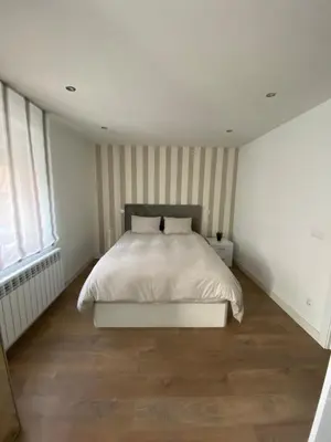 Cama o camas de una habitación en Alojamiento - Las Murallas de Dulcinea