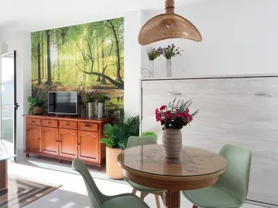 Una televisión o centro de entretenimiento en Apartamento HERVAS Mystic Home