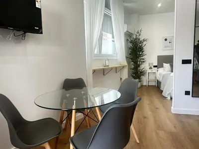Una televisión o centro de entretenimiento en Apartamentos Alimarc Urban