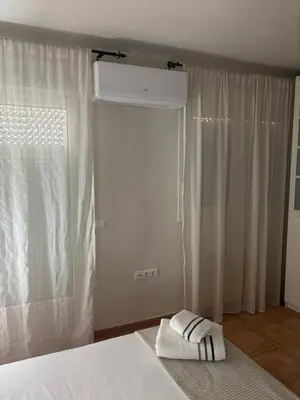 Cama o camas de una habitación en Neris Home