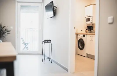 Una cocina o zona de cocina en Apartamentos Turísticos Capitán Orellana