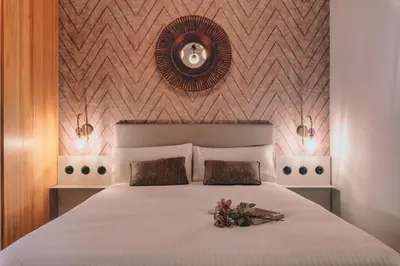 Cama o camas de una habitación en LOS MERCADERES Balneum Suites