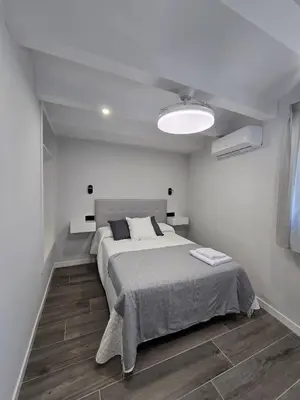 Cama o camas de una habitación en Apartamentos Turísticos AIRES DE LA VERA