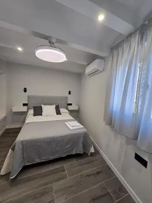 Cama o camas de una habitación en Apartamentos Turísticos AIRES DE LA VERA