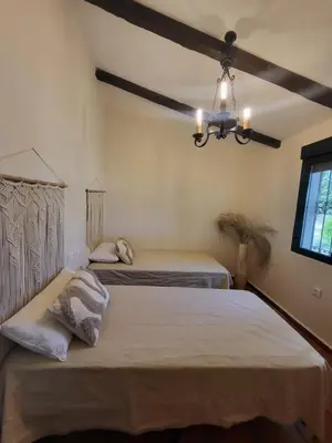 Cama o camas de una habitación en Casa Rural Amaneceres