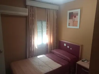 Cama o camas de una habitación en Hostal Trujillo