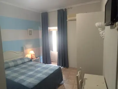Cama o camas de una habitación en Hostal Trujillo