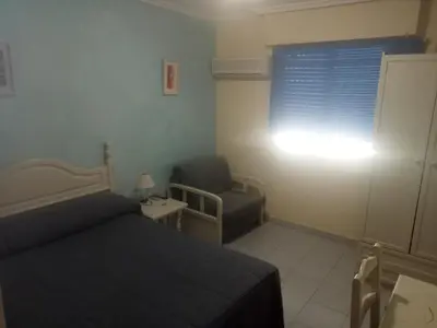 Cama o camas de una habitación en Hostal Trujillo