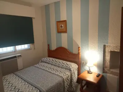 Cama o camas de una habitación en Hostal Trujillo