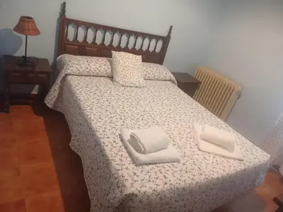 Cama o camas de una habitación en Hostal casa Hinojosa