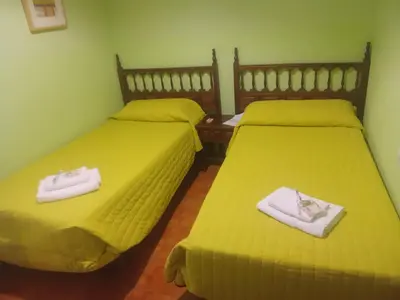 Cama o camas de una habitación en Hostal casa Hinojosa