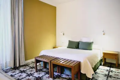 Cama o camas de una habitación en Hotel Ahc Palacio Coria