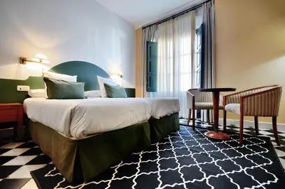 Cama o camas de una habitación en Hotel Ahc Palacio Coria