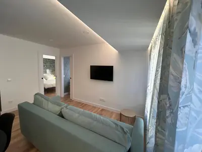 Una televisión o centro de entretenimiento en VI Apartamento dos dormitorios junto a Plaza Mayor