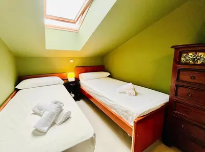 Cama o camas de una habitación en La Leyenda de Candeleda