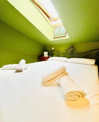 Cama o camas de una habitación en La Leyenda de Candeleda