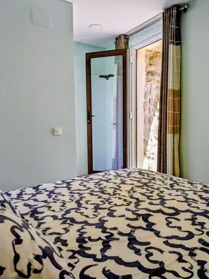 Cama o camas de una habitación en Alojamientos de turismo rural LA ESMERALDA