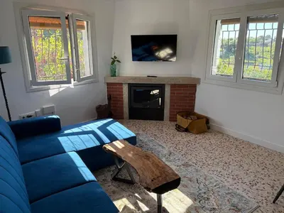 Una televisión o centro de entretenimiento en Casa Pradillo