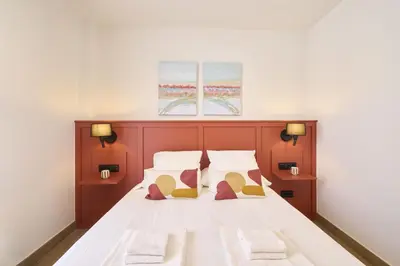 Cama o camas de una habitación en Apartamentos Plaza de San Juan
