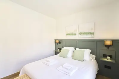 Cama o camas de una habitación en Apartamentos Plaza de San Juan