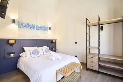 Cama o camas de una habitación en Apartamentos Plaza de San Juan
