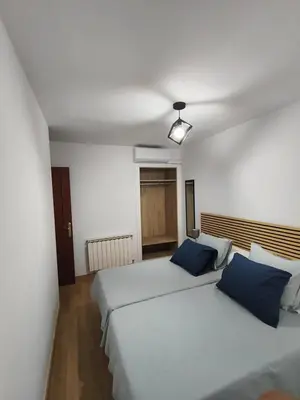 Cama o camas de una habitación en La Guinda del Jerte Apartamento Turistico