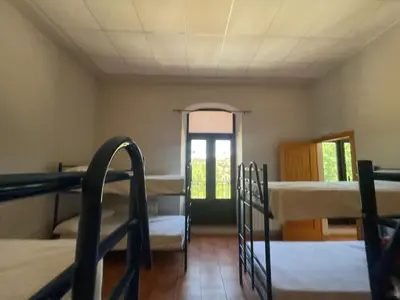 Cama o camas de una habitación en El Vagón Bar-Albergue Béjar