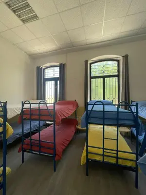 Cama o camas de una habitación en El Vagón Bar-Albergue Béjar