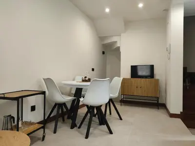 Una televisión o centro de entretenimiento en Vivienda Unifamiliar Ventana a la Clerecía
