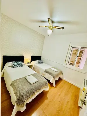 Cama o camas de una habitación en Apartamento Turístico Pizarro