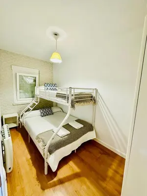 Cama o camas de una habitación en Apartamento Turístico Pizarro