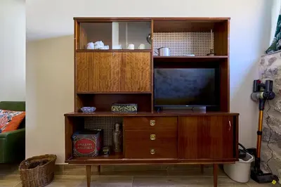 Una televisión o centro de entretenimiento en Casa Oliva by gaiarooms