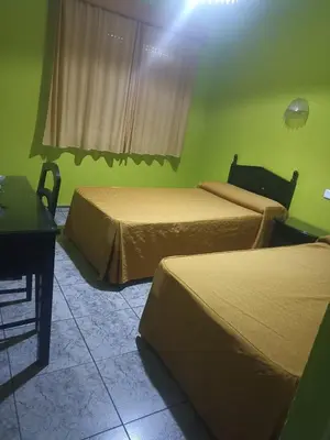Cama o camas de una habitación en Hostal Villa María