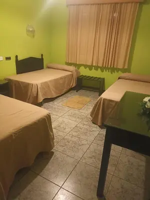 Cama o camas de una habitación en Hostal Villa María