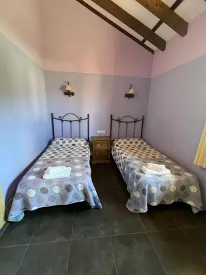 Cama o camas de una habitación en La Ondina del Madrigal