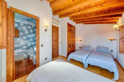 Cama o camas de una habitación en Casa Cuesta del Reloj