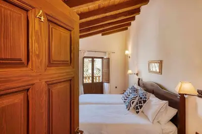 Cama o camas de una habitación en Casa Cuesta del Reloj