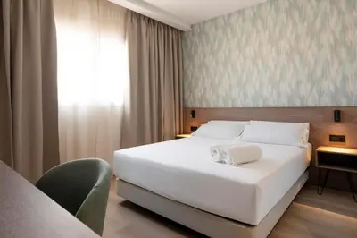 Cama o camas de una habitación en Alora Hotel Mérida
