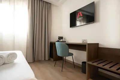 Una televisión o centro de entretenimiento en Alora Hotel Mérida