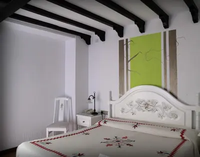 Cama o camas de una habitación en Hotel Doña Teresa