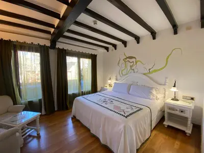 Cama o camas de una habitación en Hotel Doña Teresa