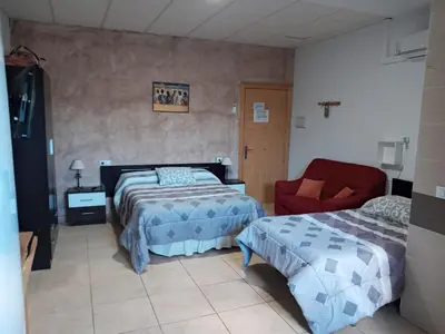Cama o camas de una habitación en Hostal Via Del Caminante