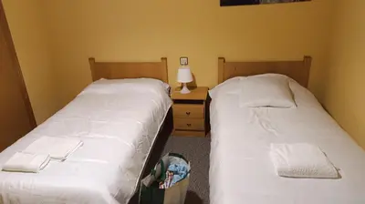 Cama o camas de una habitación en El hogar de Gregorio